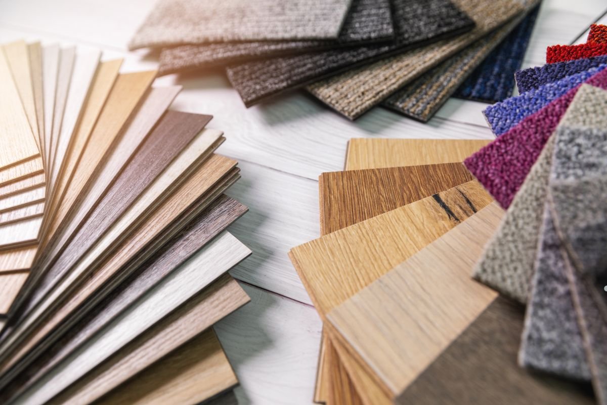 A collection of wood flooring samples showcasing various types and finishes for a flooring service display.